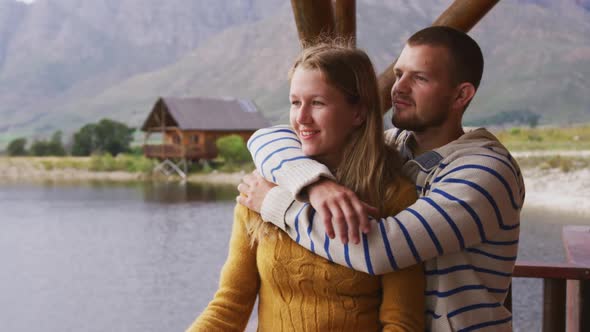 Caucasian couple spending time at home together, looking at the view