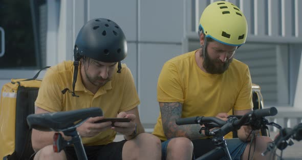 Bicycle Messengers Play Mobile Games
