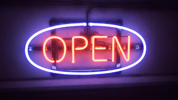 Animaton of open neon sign shining in the night. Bar, pub or shop entrance. 4KHD