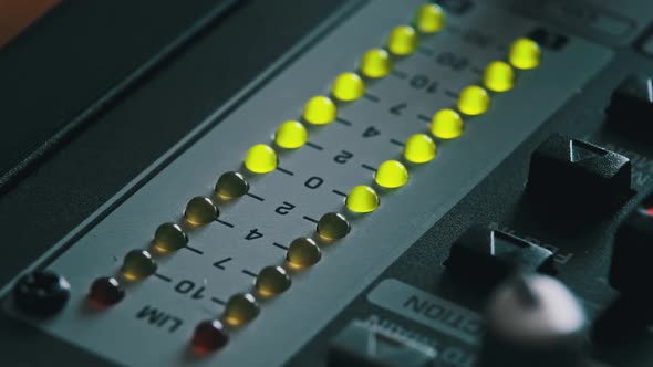 Macro Shot of Stereo LED Indicator on Mixing Console with Pulsating Sound Level