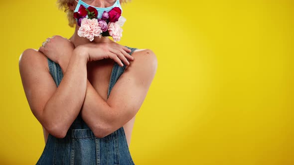 Unrecognizable Caucasian Young Man in Denim Overalls and Coronavirus Face Mask Decorated with