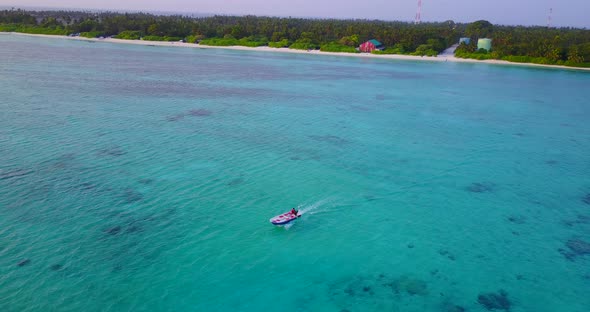 Luxury flying tourism shot of a summer white paradise sand beach and aqua turquoise water background