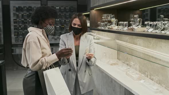 Women in Masks in Jewelry Store