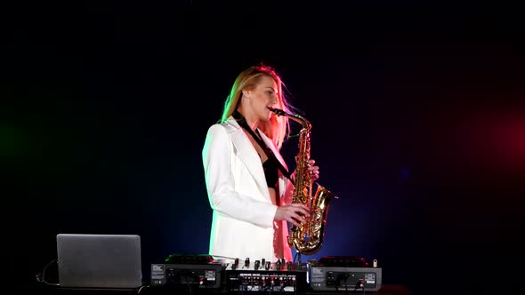 Young Sexy, Blonde Woman Dj in White Jacket Playing Music Using Saxophone on Black