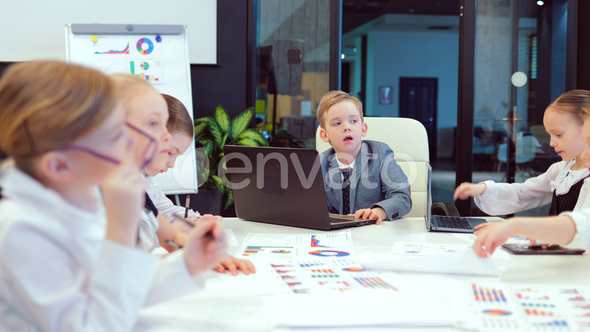 Business Children Are Meeting in a Bright Modern Office Building. They Discuss Ideas for the