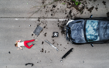 the road, unconscious. A car accident concept. Copy space.