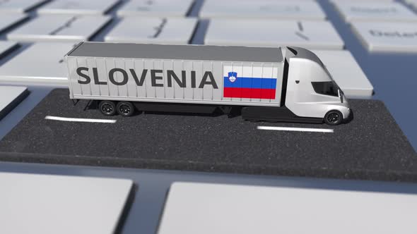 Flag of Slovenia on Moving Truck and Computer Keyboard