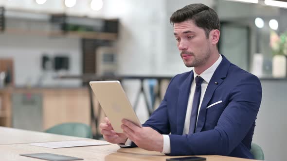 Professional Businessman Doing Video Call on Tablet 