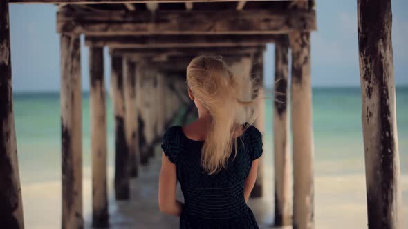 Summer Holiday Travel Vacation Adventure. Tourist Girl Walking On Beach. Calm Mood On Ocean.