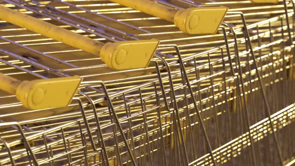 Old steel shopping carts stacked together in a long endless, looped row. 4K HD