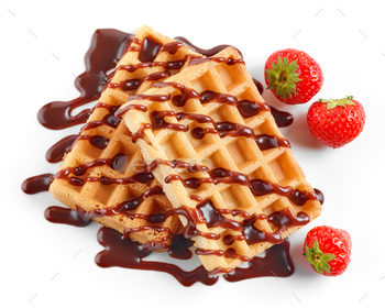 two waffles decorated with chocolat sauce and strawberries