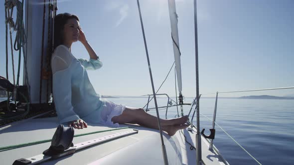 Young woman relaxing on sailboat. Shot on RED EPIC for high quality 4K, UHD, Ultra HD resolution.