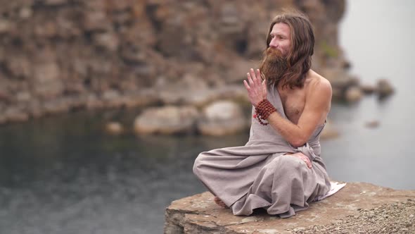 Yogi on the Rock Near the River