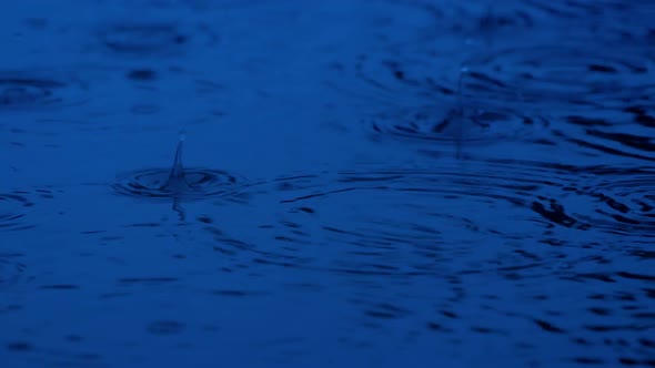 Rain Hitting Pool In The Dark