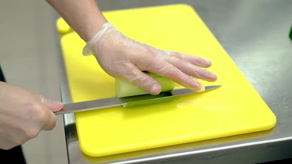 CU Cook Cleverly Cuts the Skin of the Fresh Cucumber with a Knife