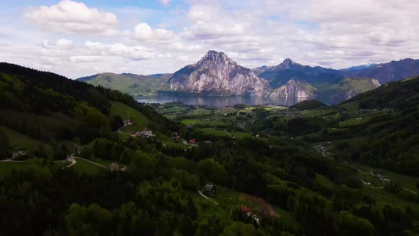 Beautiful view on the Mountains, lake and a Village Drone Video