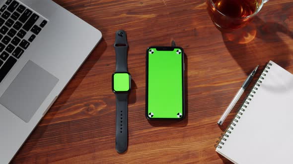 Smartwatch and Phone with Green Screen Top View