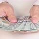 Hands of a successful businessman in a white shirt are counting a lot of paper money - VideoHive Item for Sale