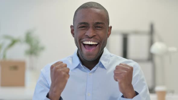 Portrait Excited African Man Celebrating Office