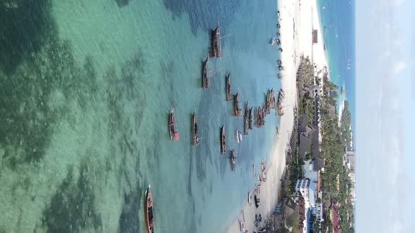 Vertical Video Boats in the Ocean Near the Coast of Zanzibar Tanzania Aerial View