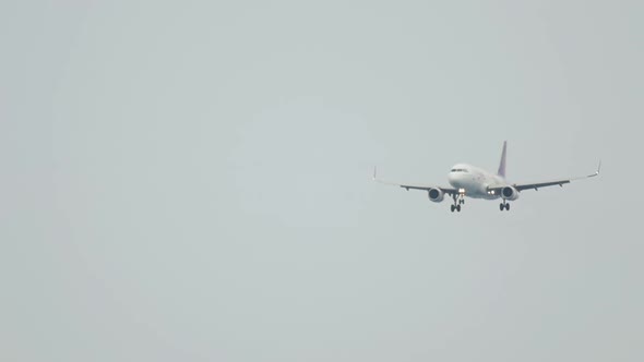 Unrecognizable Plane Landing Rain