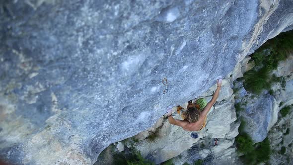 A man rock climbing up a mountain.