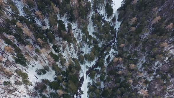 Snowy Mountains And Green Forest In Tatra Mountain In Poland Europe - aerial shot