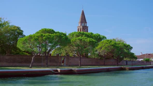 Bell Tower with Brick Fence Stands on Venice Lagoon Bank