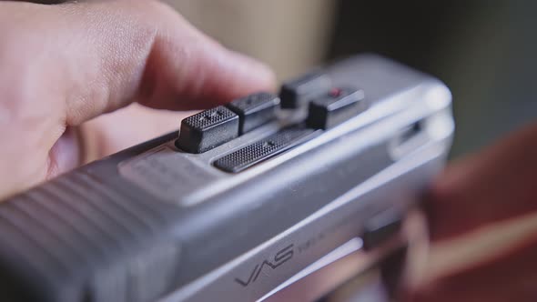 Man Finger Pressing Some Buttons on an Old Retro Vintage Cassette Tape Player