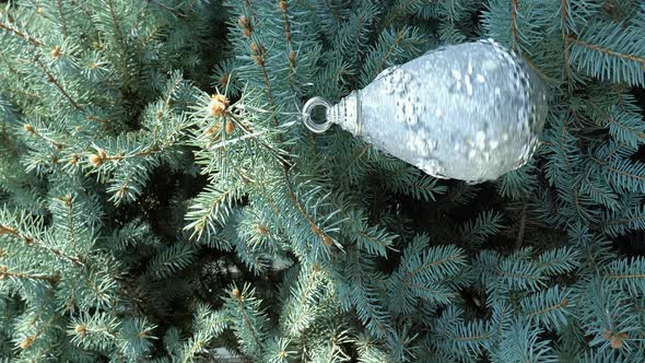 A Christmas tree toy hanging on the Christmas tree. Vertical video