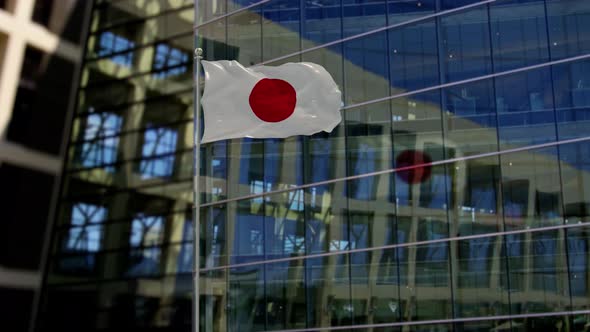 Japan Flag Waving On A Skyscraper Building