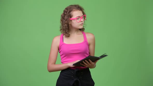 Young Happy Beautiful Nerd Woman Thinking While Reading Book