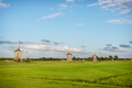 Three windmills in a spring landscape in Holland - PhotoDune Item for Sale