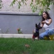 Happy Young Woman Playing with Dog at Garden - VideoHive Item for Sale