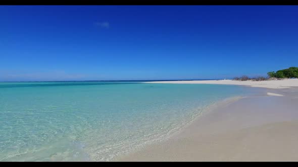 Aerial drone view landscape of luxury resort beach trip by shallow lagoon with white sandy backgroun