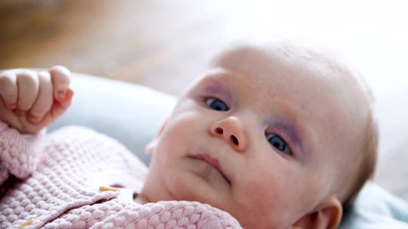 Adorable Baby Lying on Her Mattress