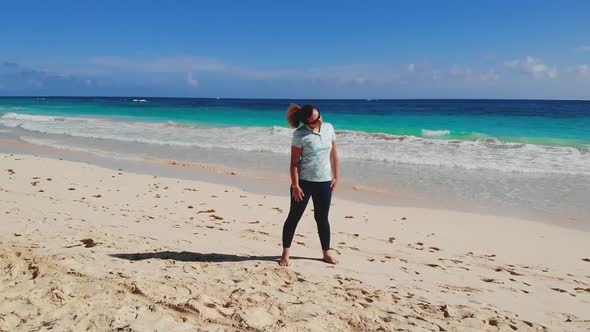 Woman Does Warm Up Breathing Exercises on Seaside