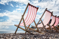 Deck chairs on the beach at the seaside summer vacation - PhotoDune Item for Sale
