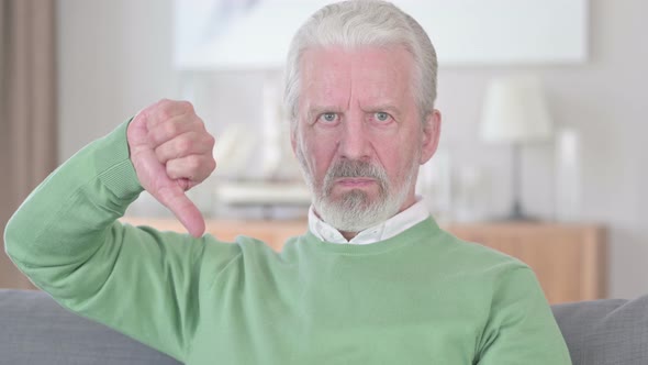 Unhappy Old Man Showing Thumbs Down