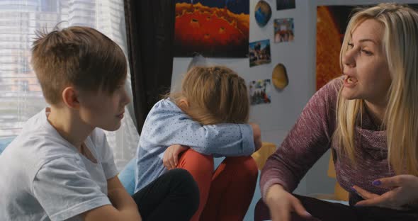 Mother Talking with Bickering Siblings