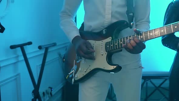 African American Guitarist Plays a Guitar at a Concert