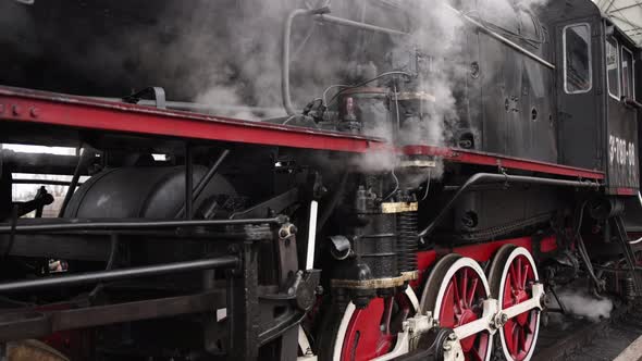 Retro Steam Train Departs From the Railway Station