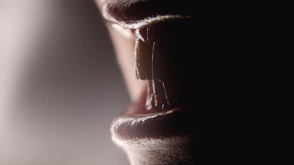 Closeup of Female Mouth Chattering Teeth in Anger Like Predator