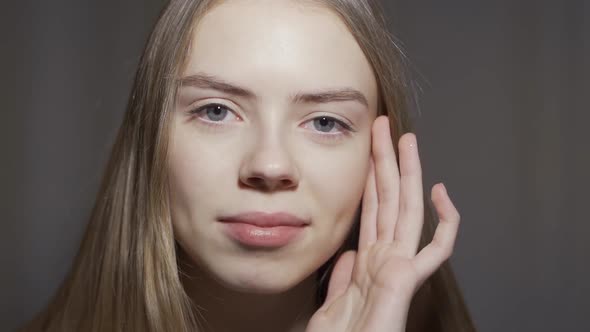 Close-up of Beautiful Gray Female Eyes. The Girl Opens Her Eyes