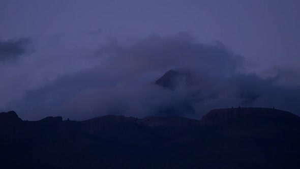 Fast forward landscape place with mountains and clouds moving and changing weather