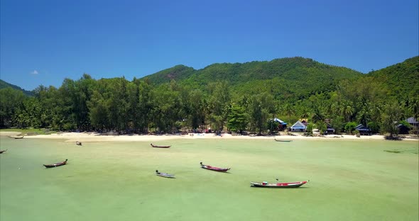 Aerial Shot of Blue Sea and longTail Boats Chaloklum Koh Phangan Thailand