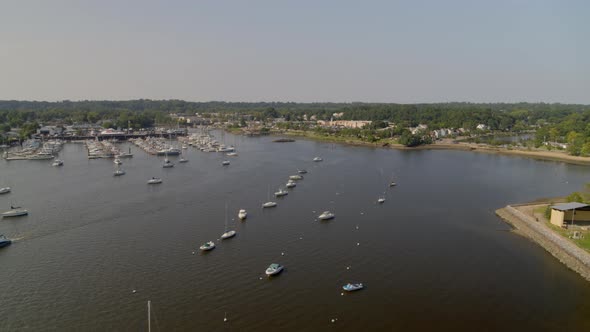 Backwards Aerial Pan of Boats Anchored at Manhasset Bay Long Island
