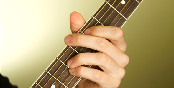 Man Playing The Guitar