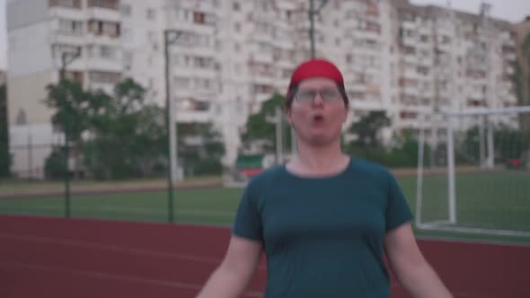 Fat Woman Jumping Rope to Lose Weight on an Outdoor Gym