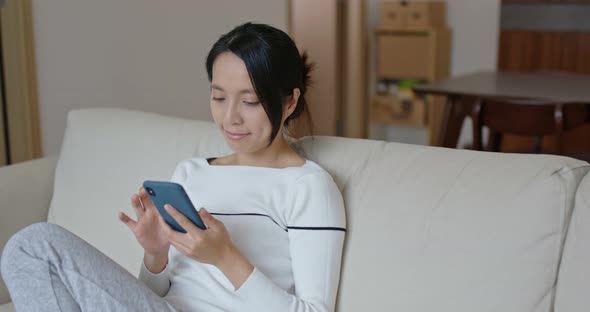 Woman use of smart phone at home